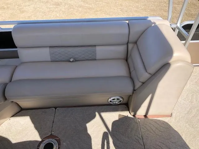 Slide: The Image of Beige seating on 2013 South Bay 726 CR boat, featuring quilted detail and speaker. - 14