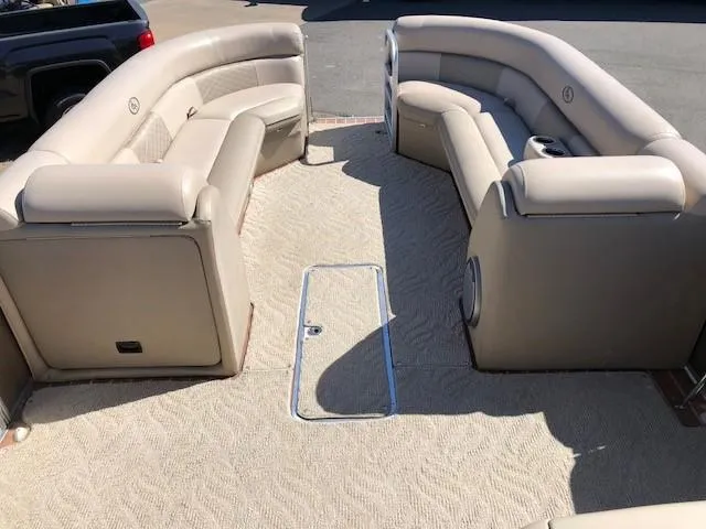 Slide: The Image of Interior of a 2013 South Bay 726 CR pontoon boat with beige seating. - 15