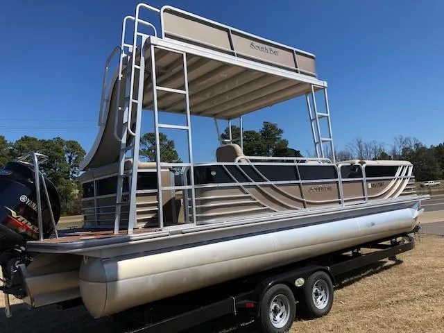 Slide: The Image of 2013 South Bay 726 CR pontoon boat on trailer, featuring a canopy and Yamaha outboard motor. - 7