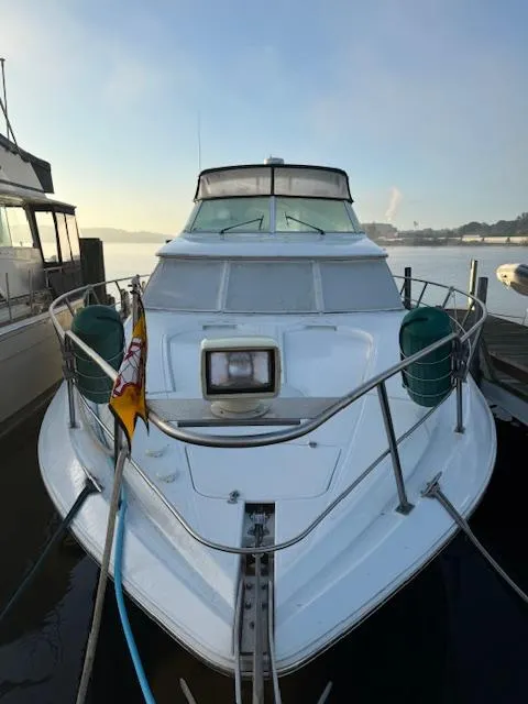 Slide: The Image of 2000 Cruisers Yachts 4450 Express Motor Yacht docked at marina. - 11