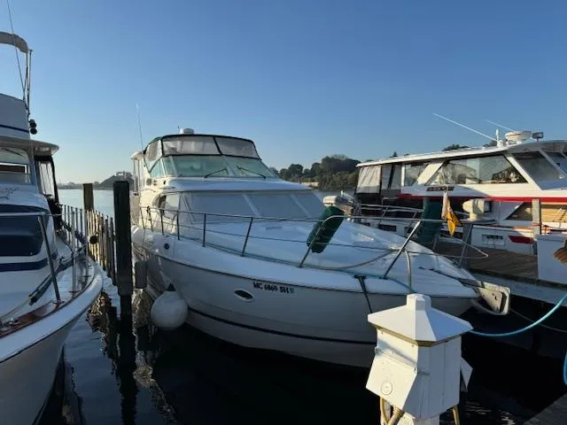 Slide: The Image of 2000 Cruisers Yachts 4450 Express Motor Yacht docked at marina. - 14