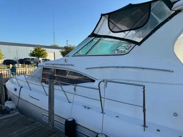 Slide: The Image of 2000 Cruisers Yachts 4450 Express Motor Yacht docked at marina. - 15