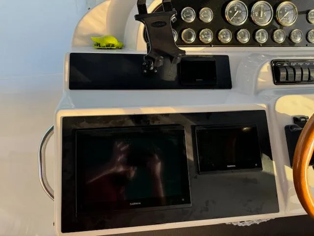 Slide: The Image of Dashboard of 2000 Cruisers Yachts 4450 Express Motor Yacht with Garmin displays and gauges. - 25