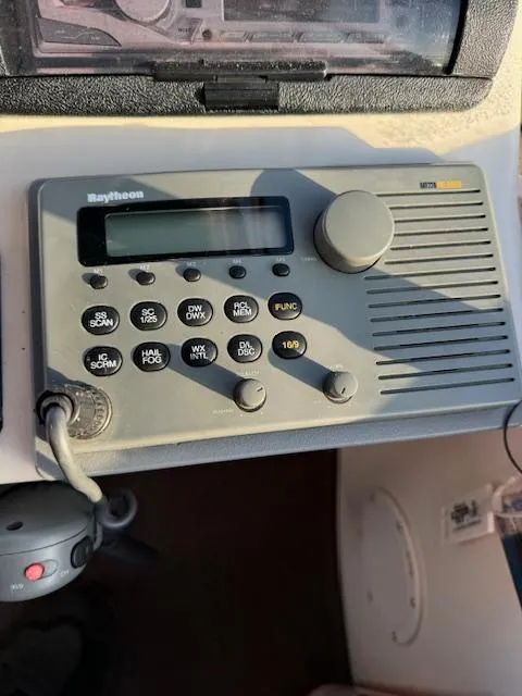 Slide: The Image of Raytheon marine radio on 2000 Cruisers Yachts 4450 Express Motor Yacht dashboard. - 27