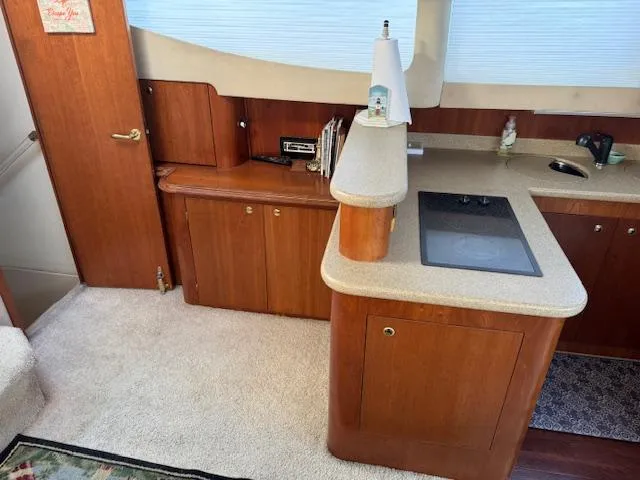 Slide: The Image of Interior of 2000 Cruisers Yachts 4450 Express Motor Yacht kitchen area. - 42