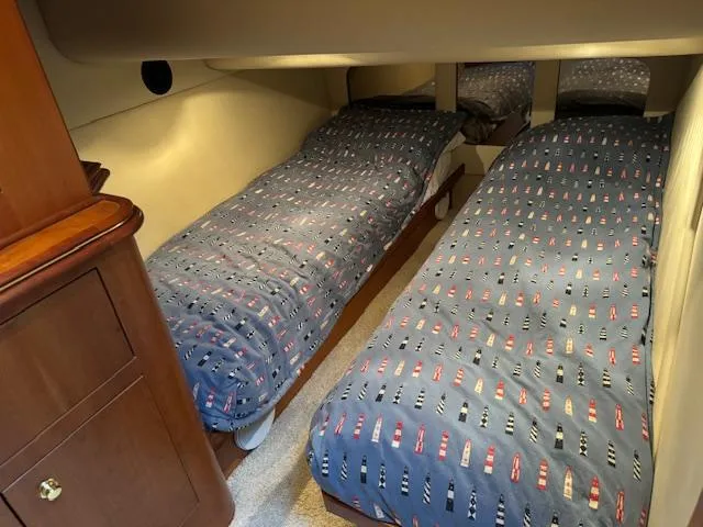 Slide: The Image of Twin beds in the 2000 Cruisers Yachts 4450 Express Motor Yacht cabin. - 47