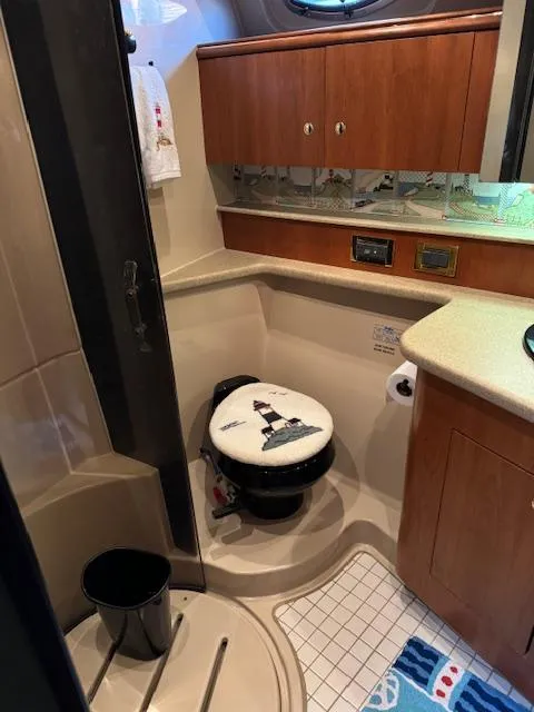 Slide: The Image of Bathroom interior of 2000 Cruisers Yachts 4450 Express Motor Yacht with nautical decor. - 49