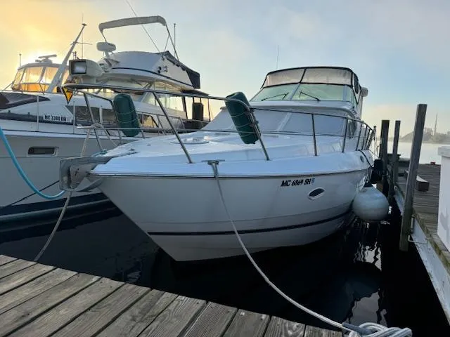 Slide: The Image of 2000 Cruisers Yachts 4450 Express Motor Yacht docked at marina. - 8