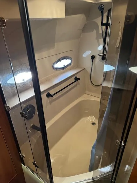 Slide: The Image of Shower area in 2000 Cruisers Yachts 4450 Express Motor Yacht with glass doors and fixtures. - 39