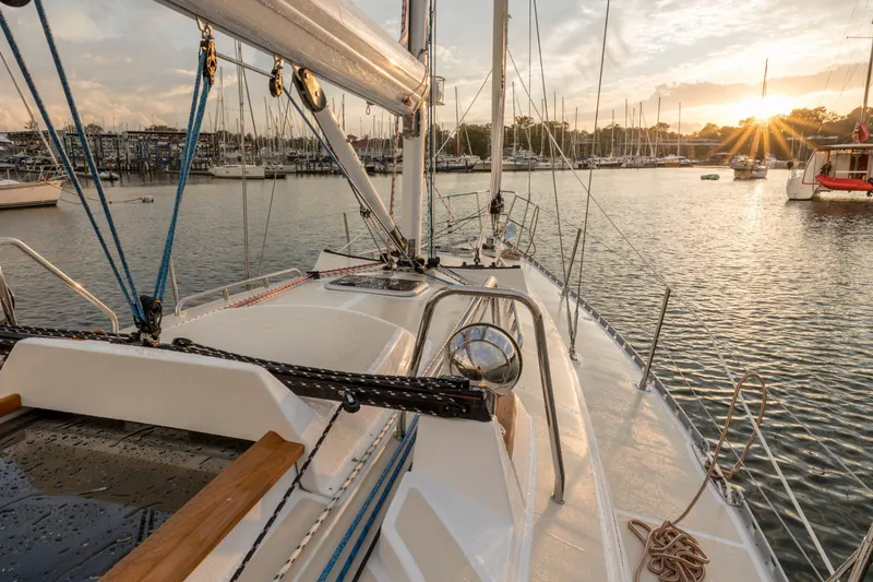 Slide: The Image of Sailing yacht Tartan 365, 2025 model, docked at sunset in a serene marina. - 8