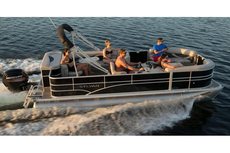 Slide: The Image of 2023 Sylvan 8520 Mirage Cruise pontoon boat on water with passengers enjoying a ride. - 0