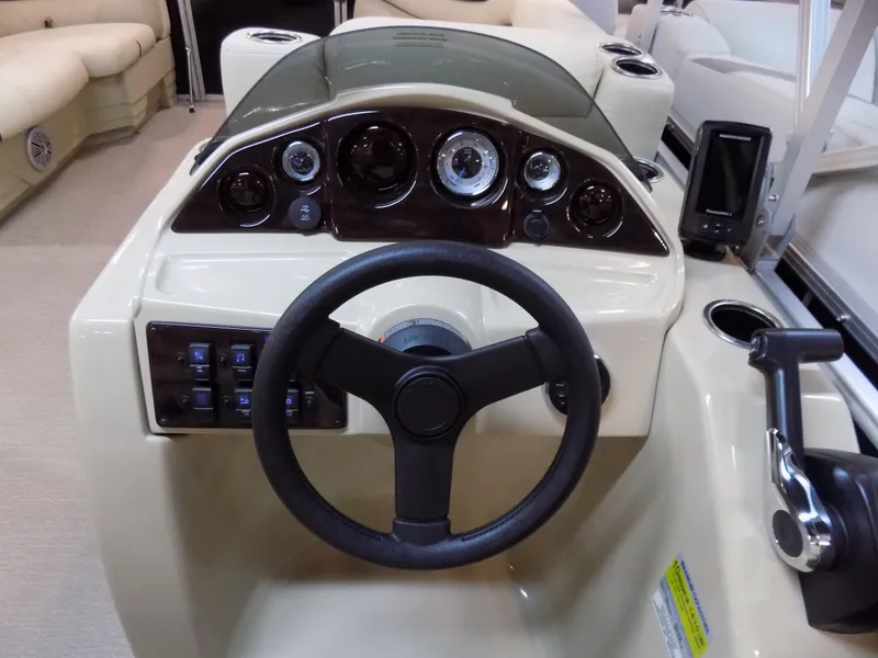 Slide: The Image of 2023 Sylvan 8520 Mirage Cruise dashboard with steering wheel and control panel. - 10
