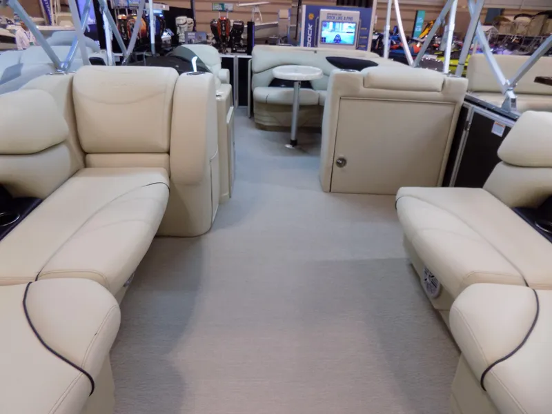 Slide: The Image of 2023 Sylvan 8520 Mirage Cruise interior with beige seating and modern design. - 2