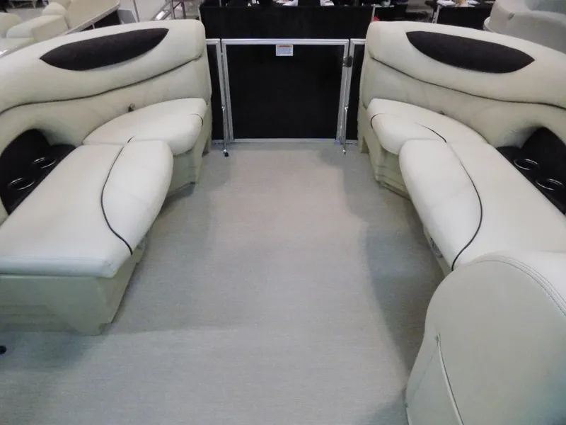 Slide: The Image of 2023 Sylvan 8520 Mirage Cruise interior with plush seating and modern design. - 3