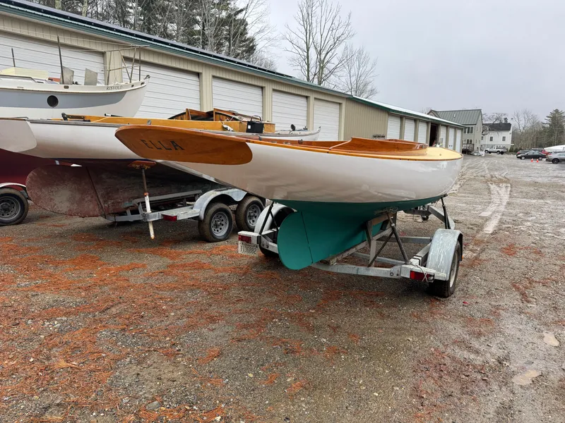 Slide: The Image of Herreshoff Watch Hill 15 sailboat on trailer, 1994 model, parked outdoors. - 15