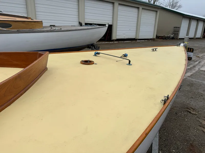 Slide: The Image of Herreshoff Watch Hill 15 sailboat deck, 1994 model, in storage near garages. - 19