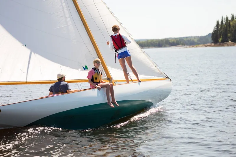 Slide: The Image of Sailing on a 1994 Herreshoff Watch Hill 15 with two people enjoying the view. - 2