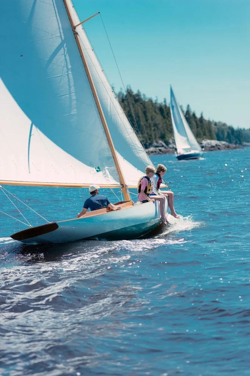 Slide: The Image of Sailing on a 1994 Herreshoff Watch Hill 15 in sunny, clear waters. - 7