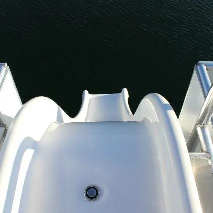 Slide: The Image of White slide on Bravada Apollo Trip #1 houseboat, 2014, leading into water. - 12