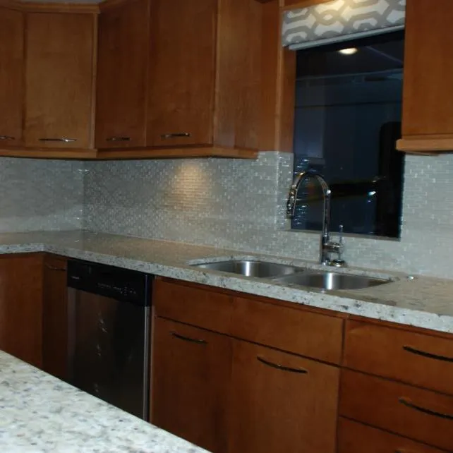 Slide: The Image of Modern kitchen with wooden cabinets, granite countertops, and stainless steel sink in Bravada Apollo Trip #1. - 17