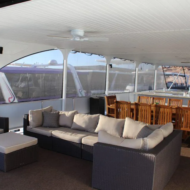Slide: The Image of Luxurious 2014 Bravada Apollo Trip #1 yacht interior with comfortable seating and dining area. - 4