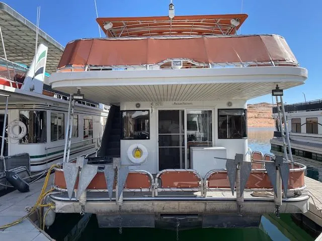 Slide: The Image of 2007 American Waterways Sundancer Trip 16 houseboat docked at marina. - 2