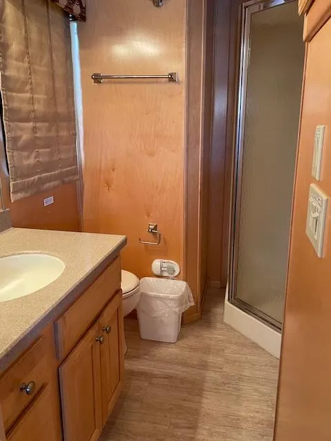 Slide: The Image of 2007 American Waterways Sundancer Trip 16 bathroom with shower, sink, and toilet. - 6