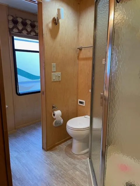 Slide: The Image of 2007 American Waterways Sundancer Trip 16 bathroom with shower, toilet, and window. - 7