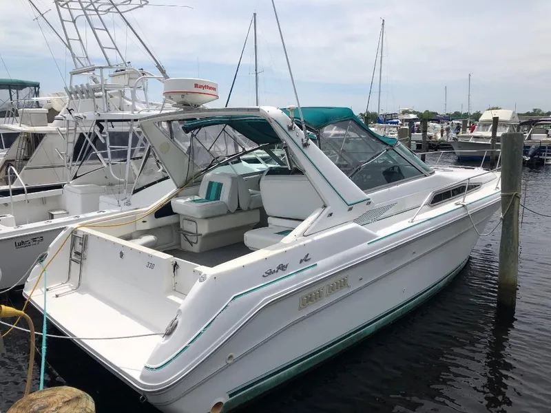 Slide: The Image of 1993 Sea Ray 330 Express Cruiser docked at marina. - 2