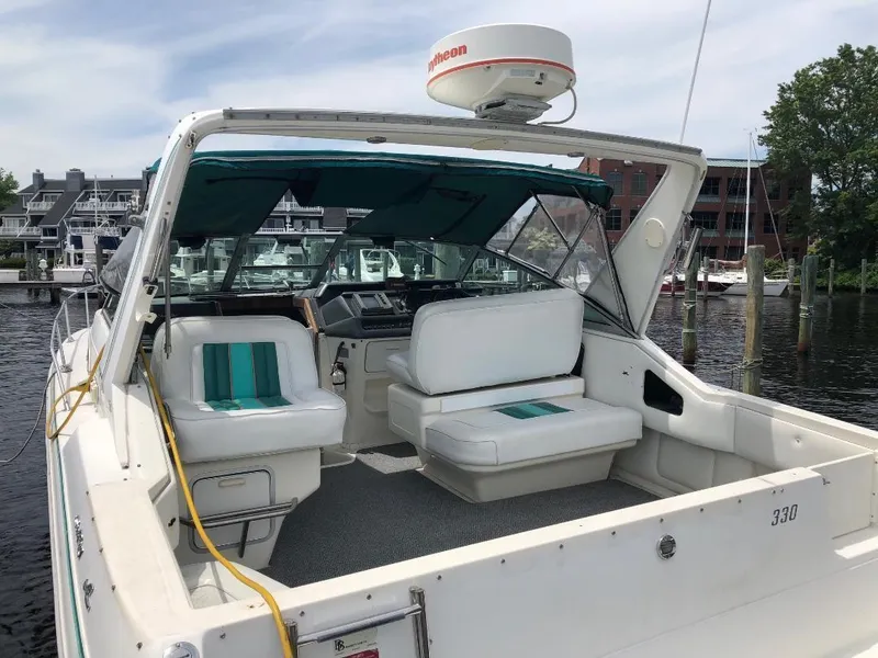 Slide: The Image of 1993 Sea Ray 330 Express Cruiser boat docked at marina, interior view. - 5