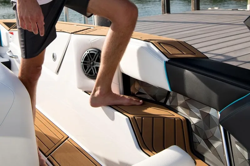 Slide: The Image of 2023 Nautique Ski boat interior with teak flooring and modern design. - 39