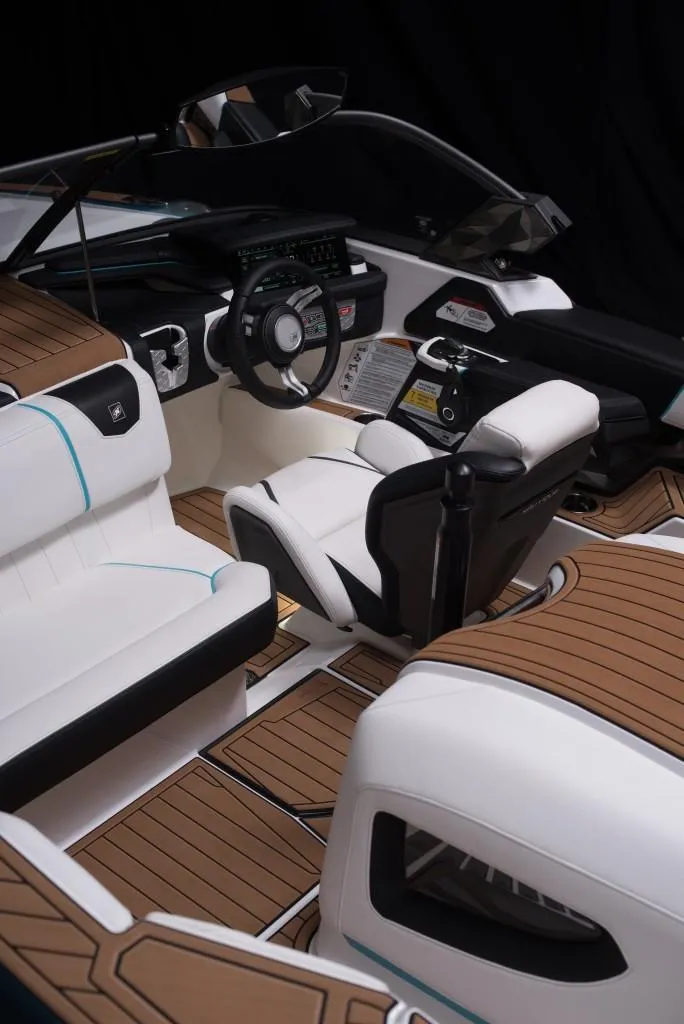Slide: The Image of 2023 Nautique Ski boat interior with modern dashboard and luxurious seating. - 44
