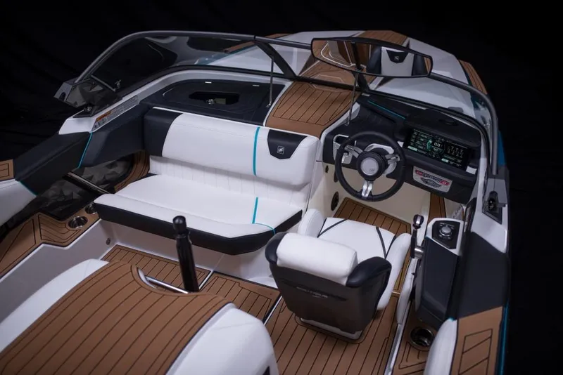 Slide: The Image of 2023 Nautique Ski boat interior with modern dashboard and seating. - 46