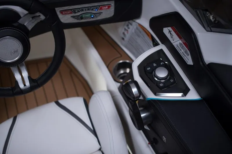Slide: The Image of 2023 Nautique Ski boat interior with steering wheel and control panel. - 47