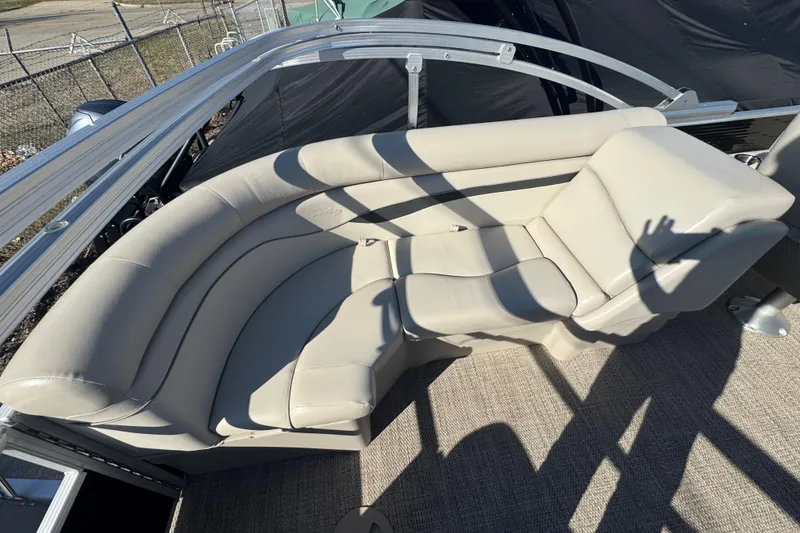 Slide: The Image of 2018 Bennington 22SSRX boat with beige seating and carpeted floor. - 14