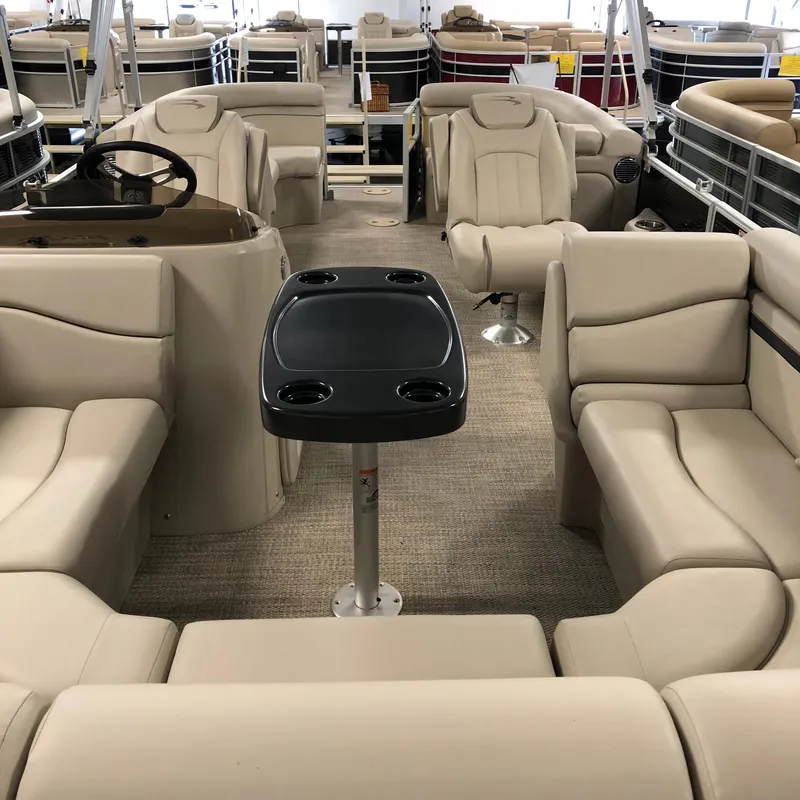 Slide: The Image of Interior of a 2018 Bennington 22SSRX pontoon boat with beige seating. - 7