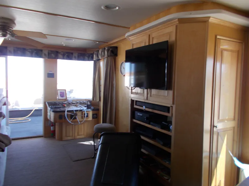 Slide: The Image of Interior of 2005 Stardust Cruisers Summer Obsession Trip 36 houseboat with TV and steering area. - 19