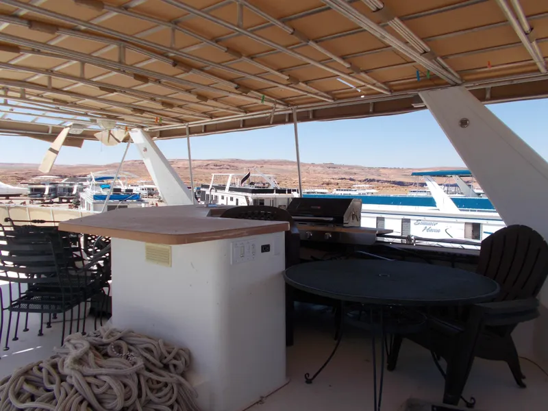 Slide: The Image of Top deck of 2005 Stardust Cruisers Summer Obsession Trip 36 with outdoor seating and grill. - 23