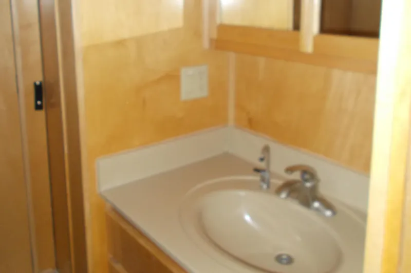 Slide: The Image of Bathroom sink area in a 2005 Stardust Cruisers Summer Obsession Trip 36 houseboat. - 9