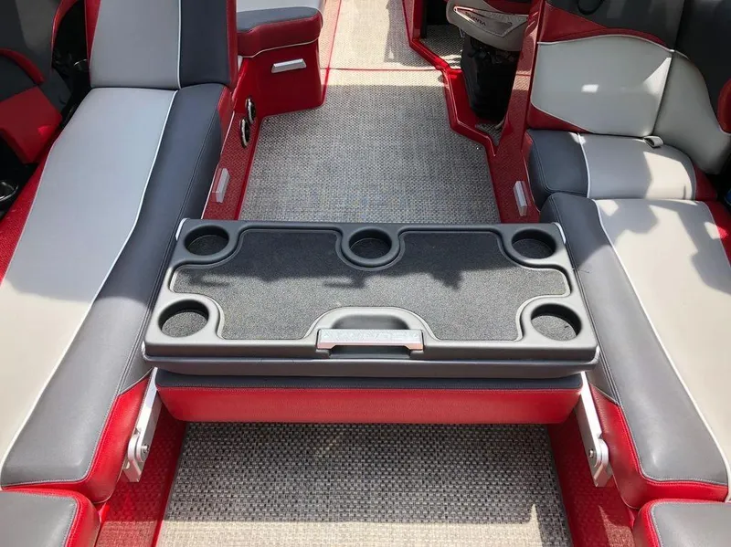 Slide: The Image of Interior of 2015 Supra SE 450 boat with red and gray seating and cup holders. - 17