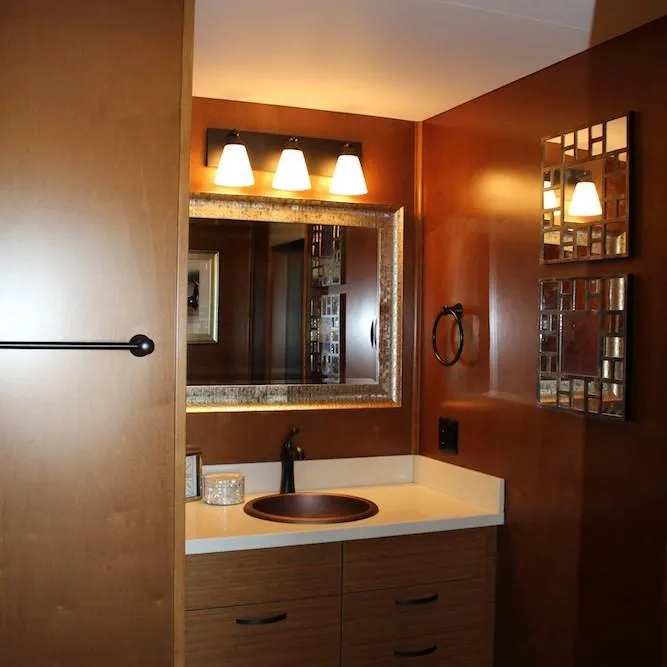 Slide: The Image of Modern bathroom in 2014 Bravada Infinity Trip #1 with wooden cabinets and elegant lighting. - 11