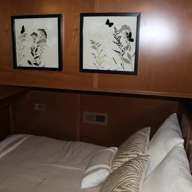 Slide: The Image of Cozy bedroom in 2014 Bravada Infinity Trip #1 houseboat with framed butterfly art. - 16