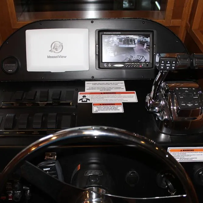 Slide: The Image of Control panel of a 2014 Bravada Infinity Trip #1 boat with VesselView display. - 2