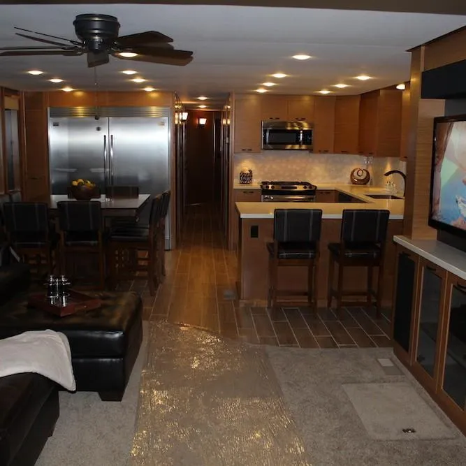 Slide: The Image of Luxurious 2014 Bravada Infinity Trip #1 RV interior with modern kitchen and living area. - 3