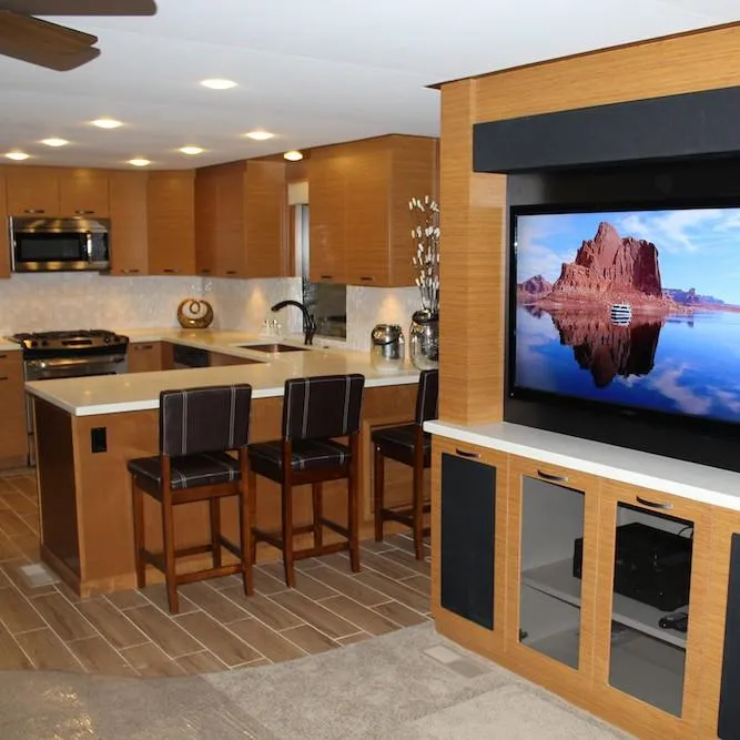 Slide: The Image of Modern kitchen in 2014 Bravada Infinity Trip #1 houseboat with island, bar stools, and flat-screen TV. - 4