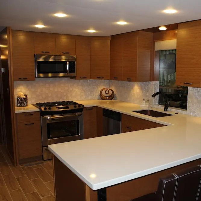 Slide: The Image of Modern kitchen in Bravada Infinity Trip #1, 2014 model, with stainless steel appliances and wooden cabinets. - 5