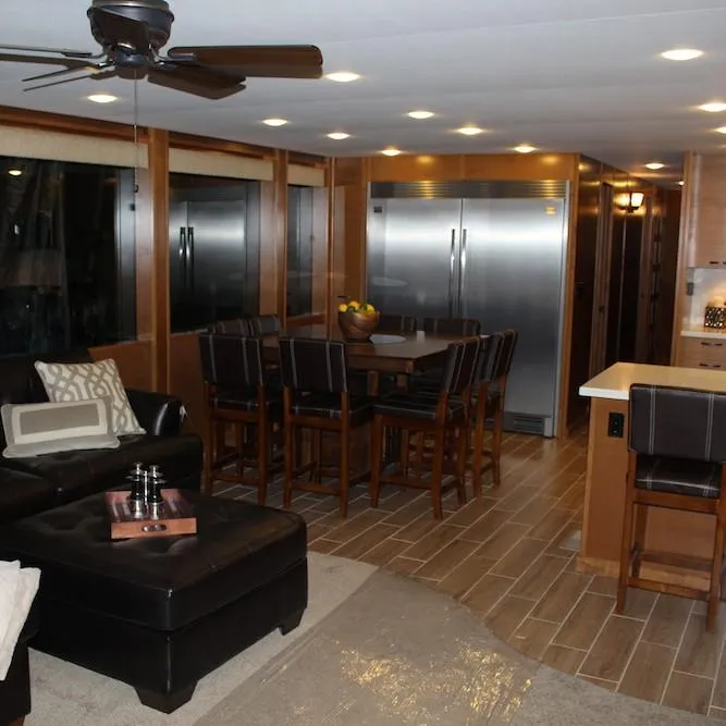 Slide: The Image of Luxurious interior of 2014 Bravada Infinity Trip #1 with modern kitchen and dining area. - 8