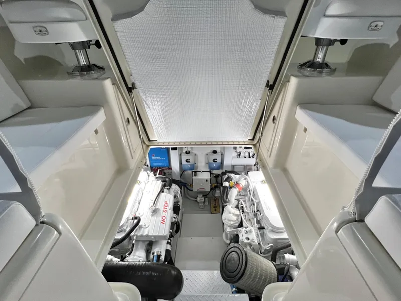 Slide: The Image of Engine room of 2025 Henriques 30' Express boat, showcasing dual engines and clean layout. - 13