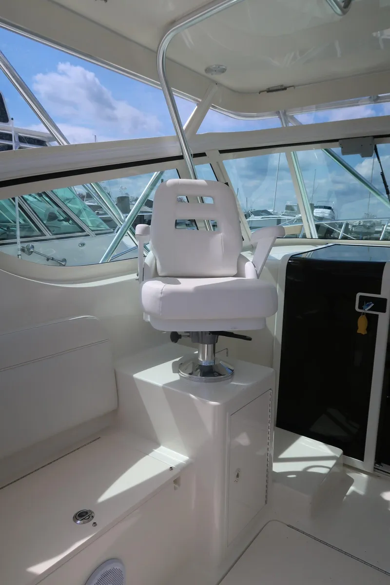 Slide: The Image of 2025 Henriques 30' Express boat interior with captain's chair. - 17
