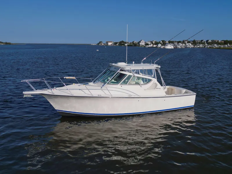 Slide: The Image of 2025 Henriques 30' Express boat on calm waters. - 3